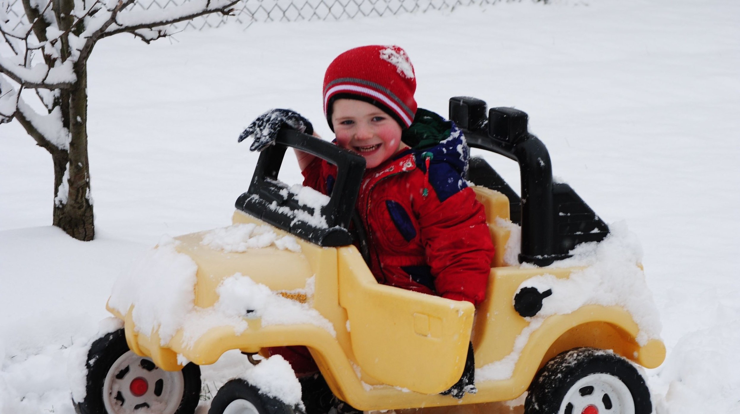 Kid in snow driving