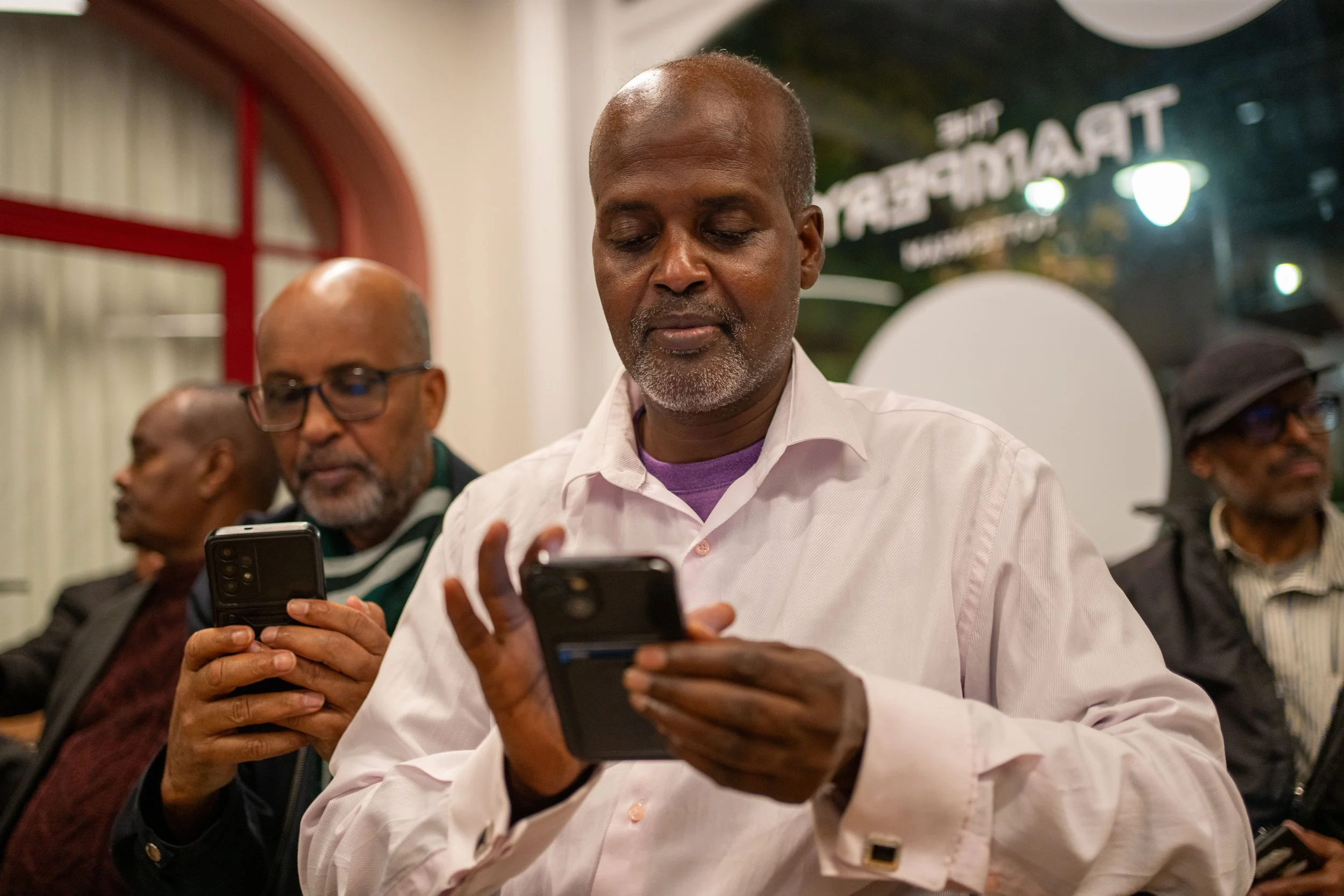 Community participant taking part in a RISE and IOM digital financial literacy workshop
