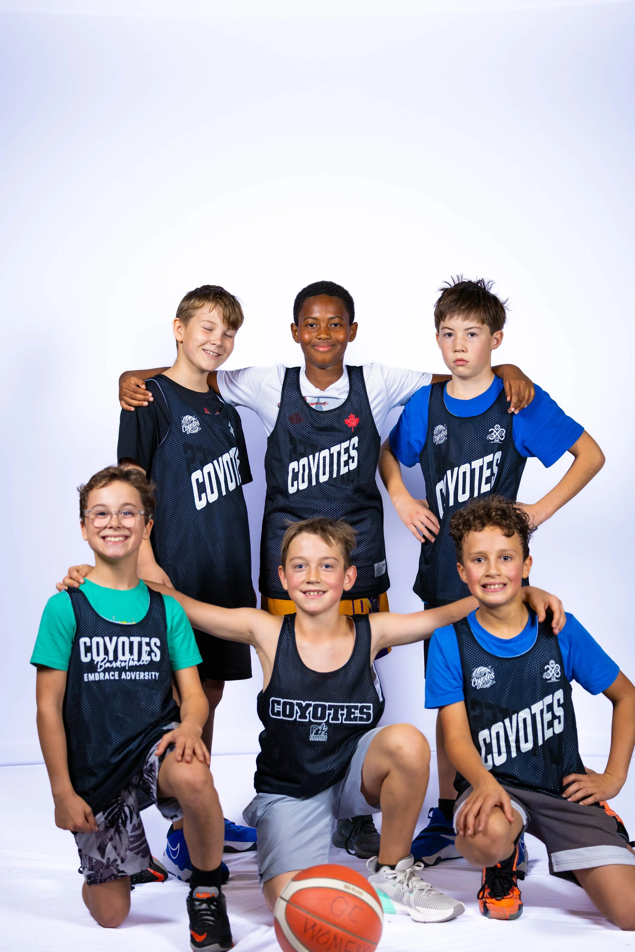 Junior Coyotes players in Coyotes pinnies at a Kelowna basketball camp
