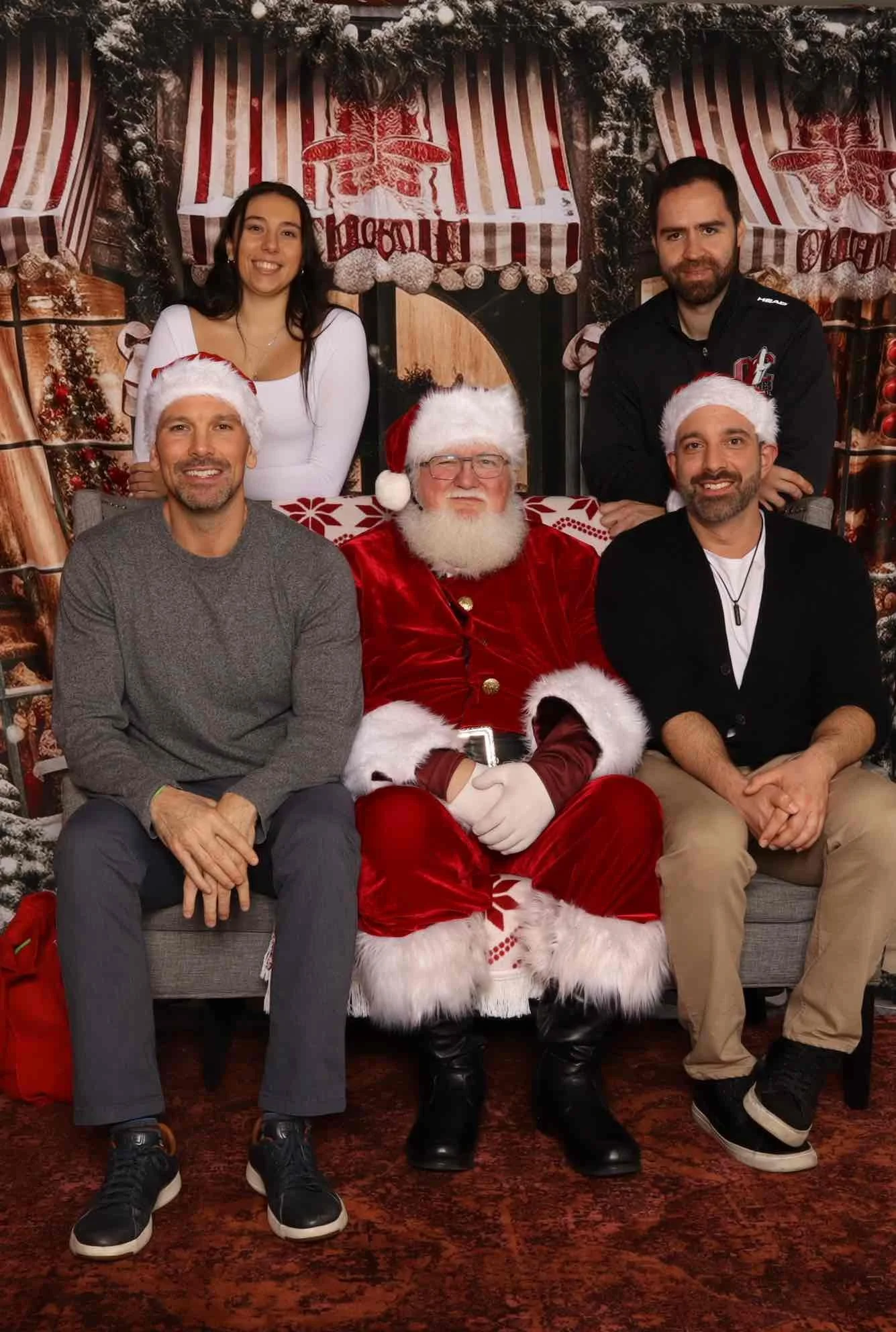 Junior Coyotes basketball families celebrating Christmas with Santa