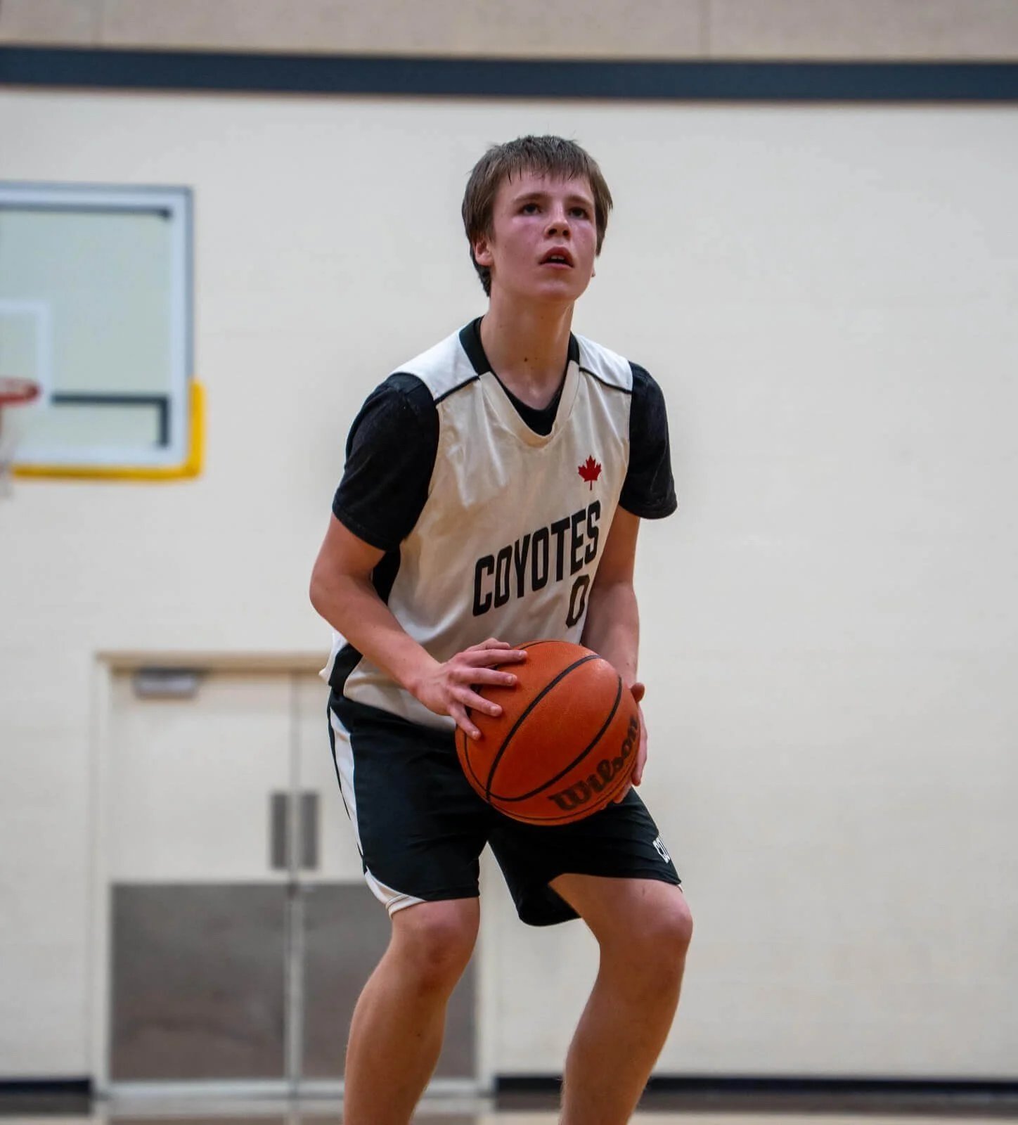 Junior Coyotes player shooting — Camp July 22–24
