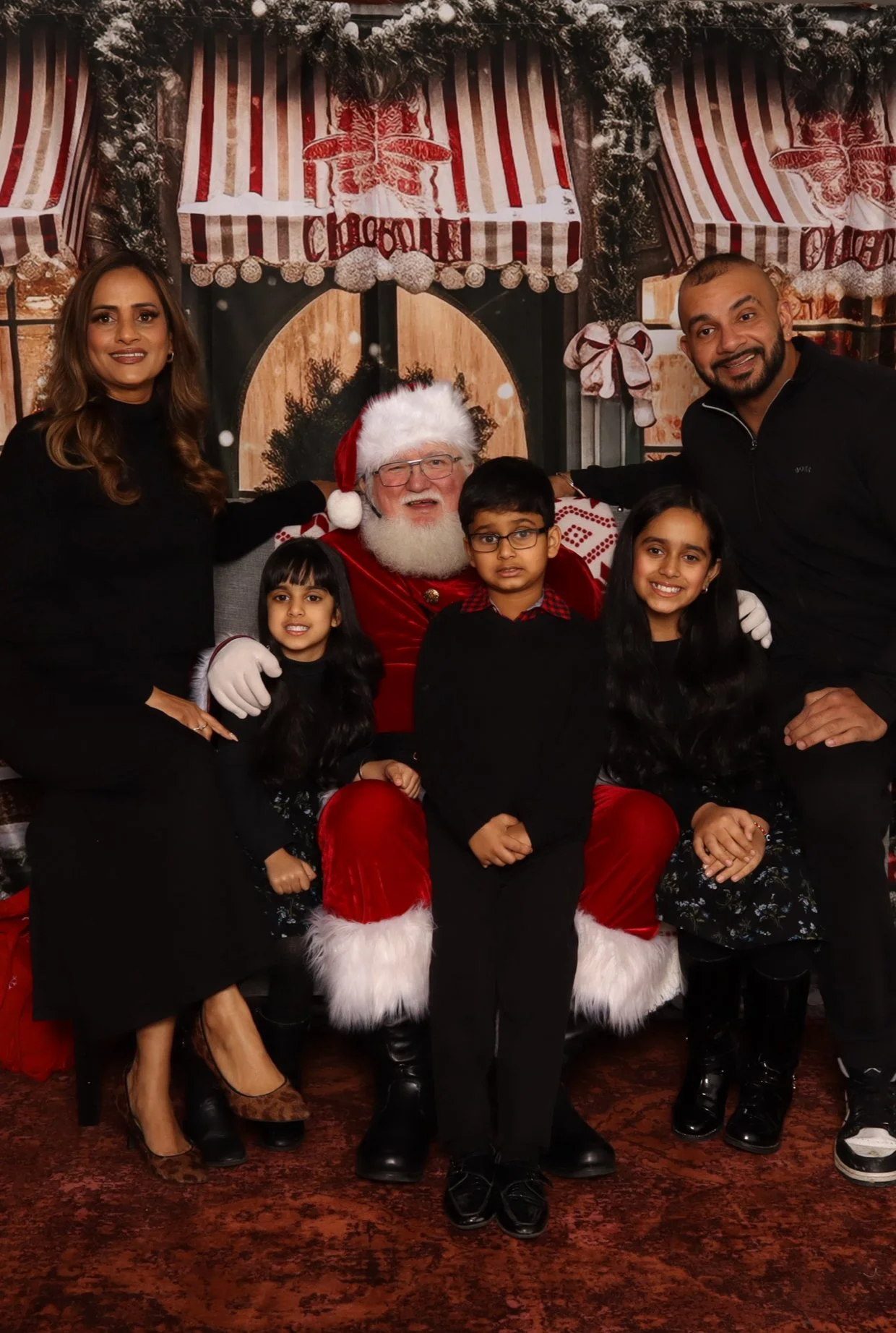 Junior Coyotes Christmas event in Kelowna — family photo with Santa