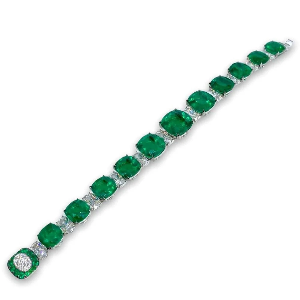 Line bracelet with eleven principal cushion emeralds and diamonds, IMP26-060