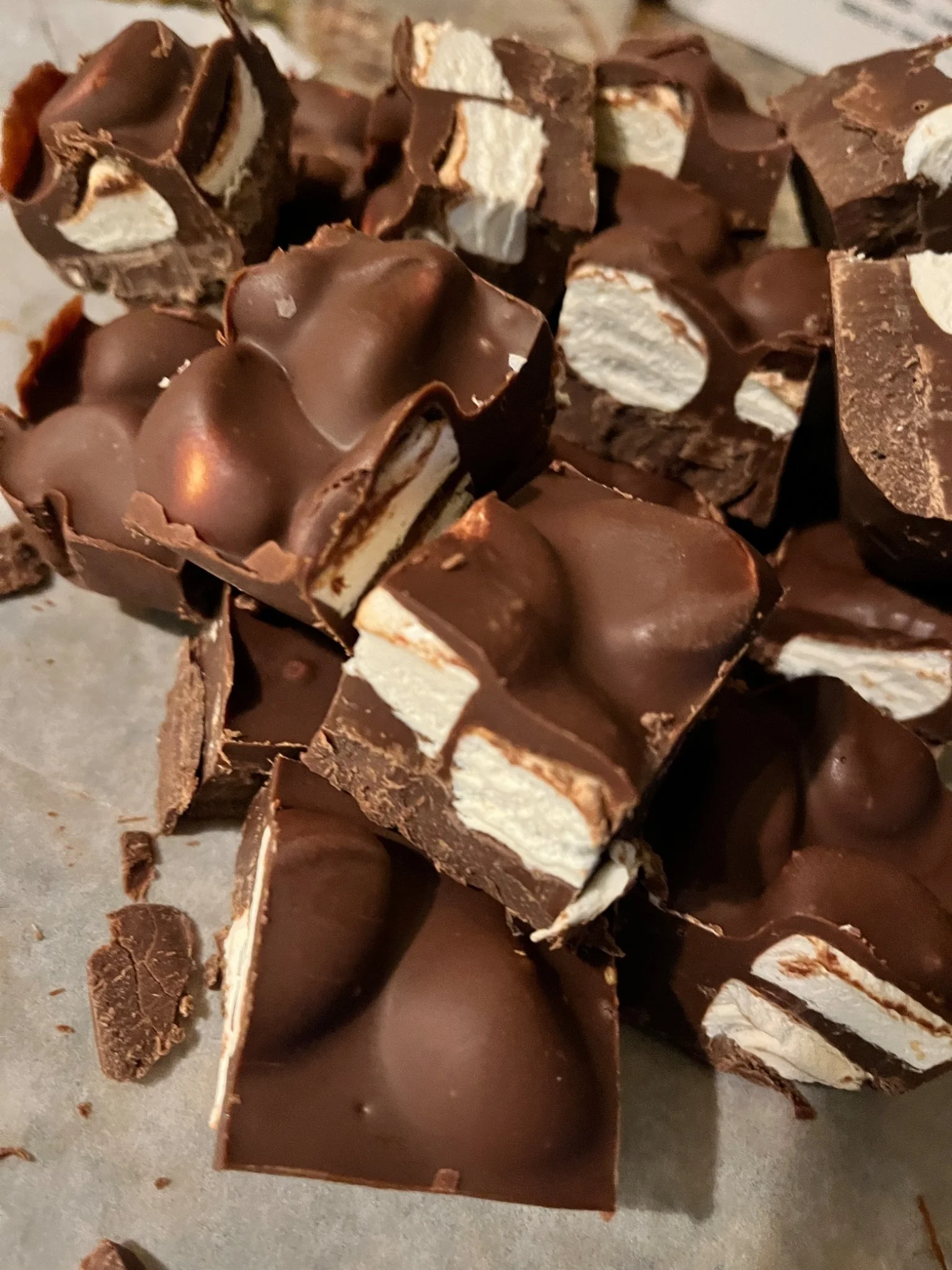 Chocolate-coated candy bar pieces arranged together.