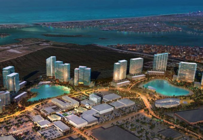 A view of SoLe mia skyline with modern buildings rising above the water, showcasing the city