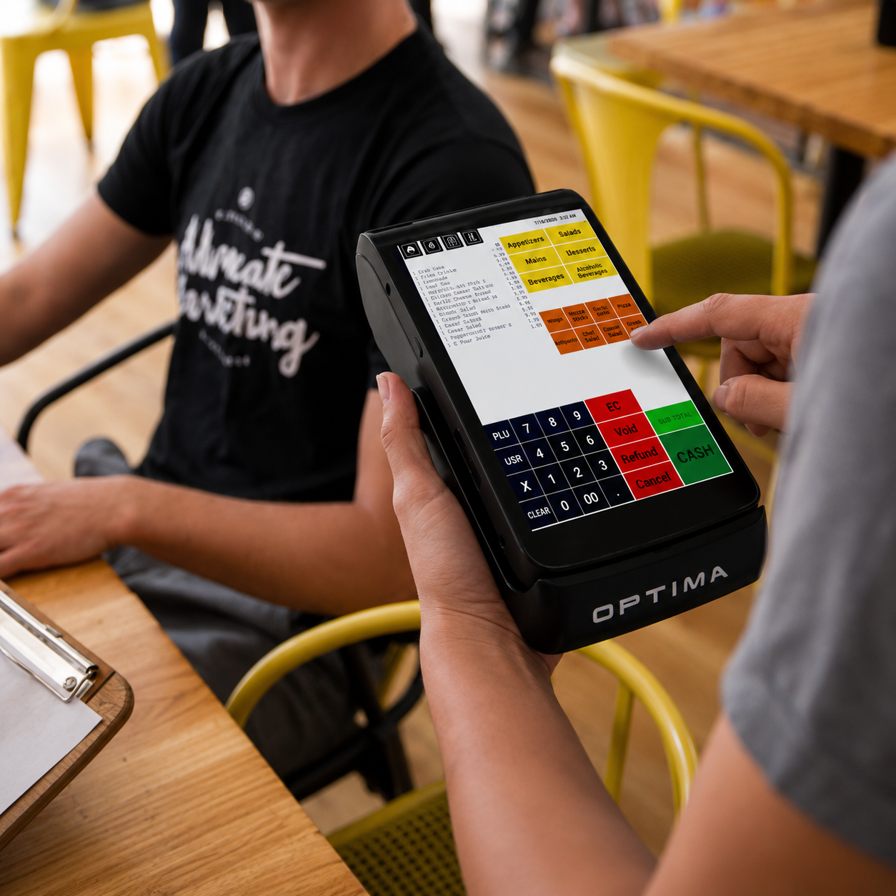 Server using the Optima APOS-01 handheld POS at a restaurant table
