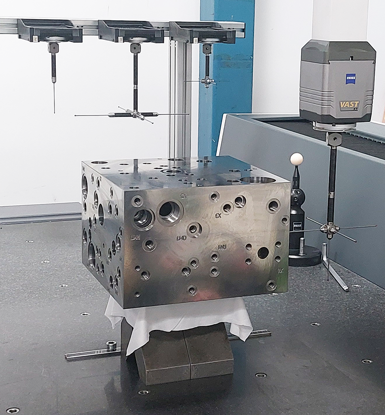 CMM coordinate measuring machine inspecting a large valve component