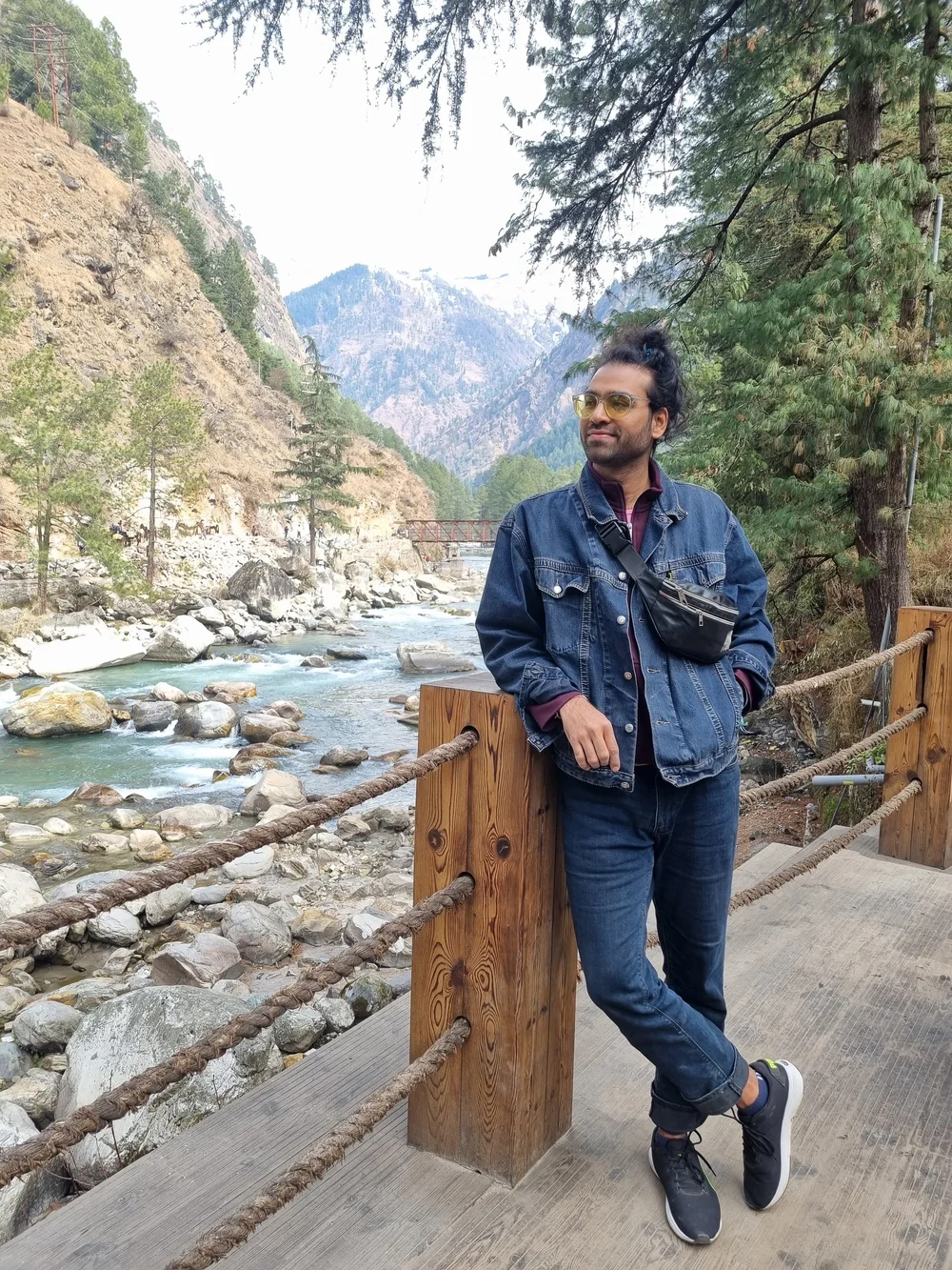 Ashvin Kumar Mishra beside a Himalayan river