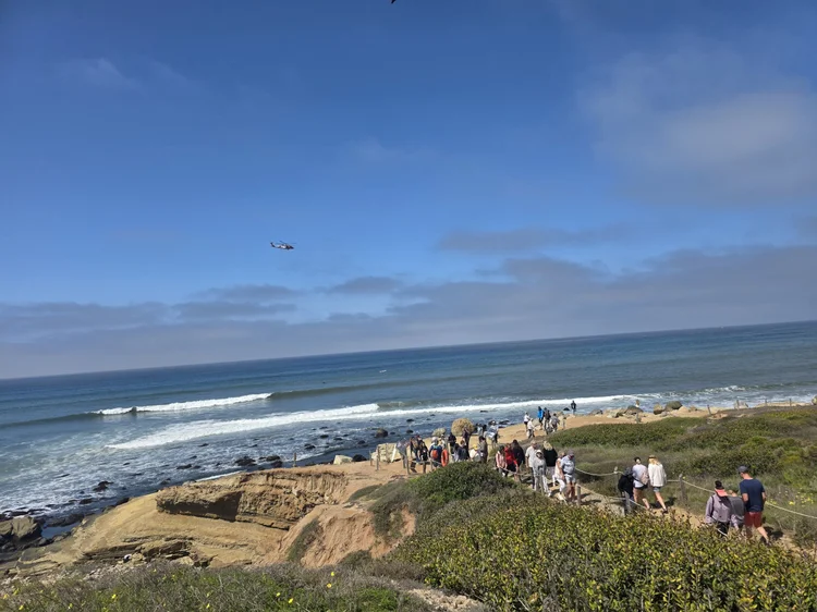 Coastal overlook with group on the bluff