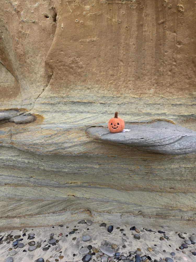 Undercut sandstone cliff, student for scale