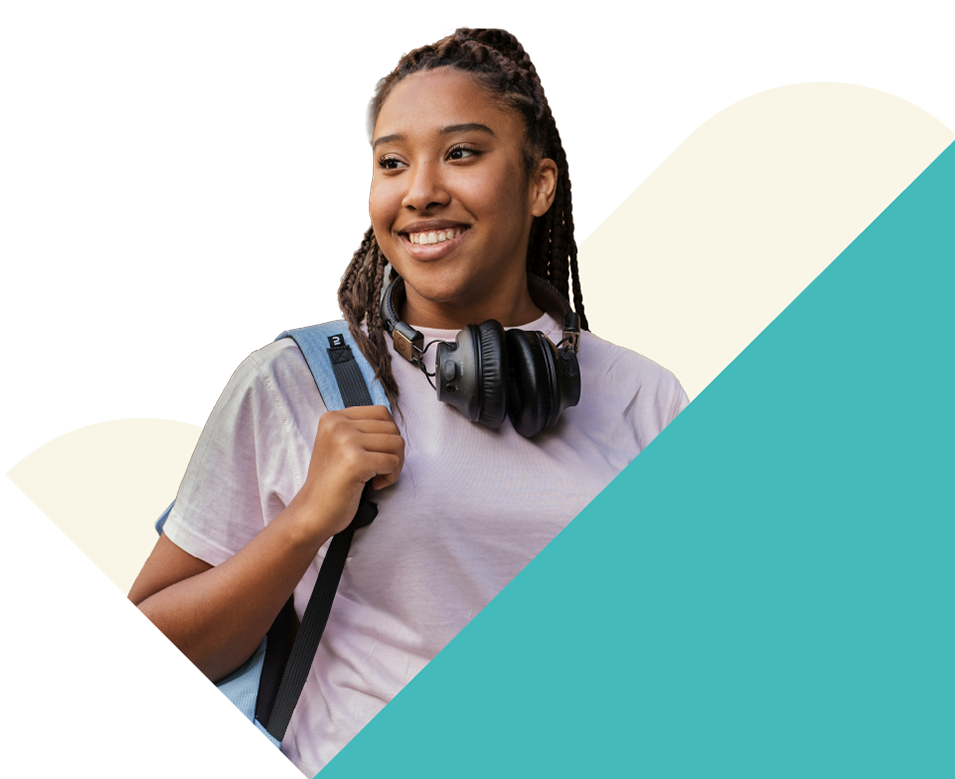 A smiling high schooler with a backpack