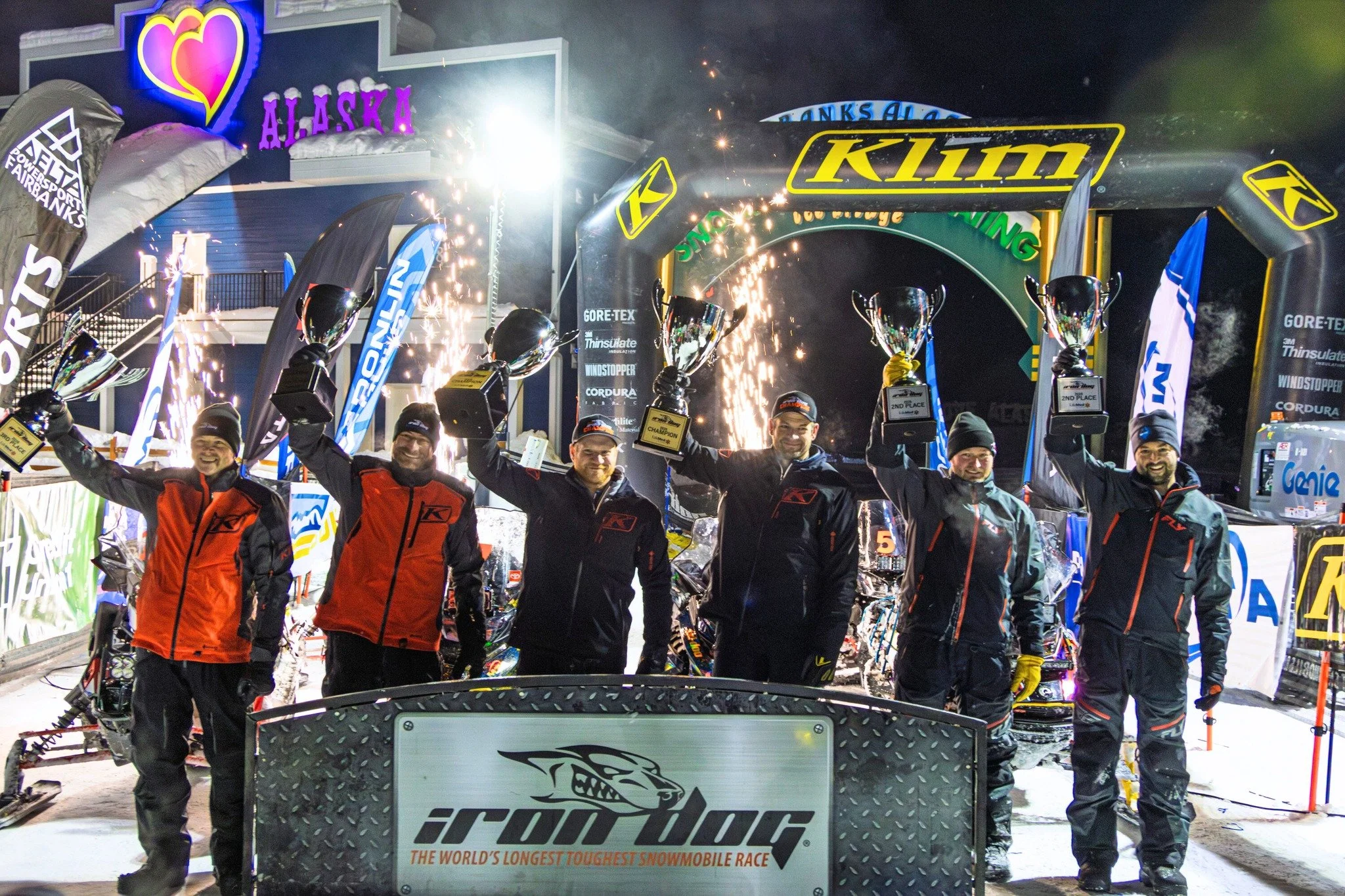 2026 Iron Dog Champions Nick Olstad and Tyler Aklestad celebrating at the finish line