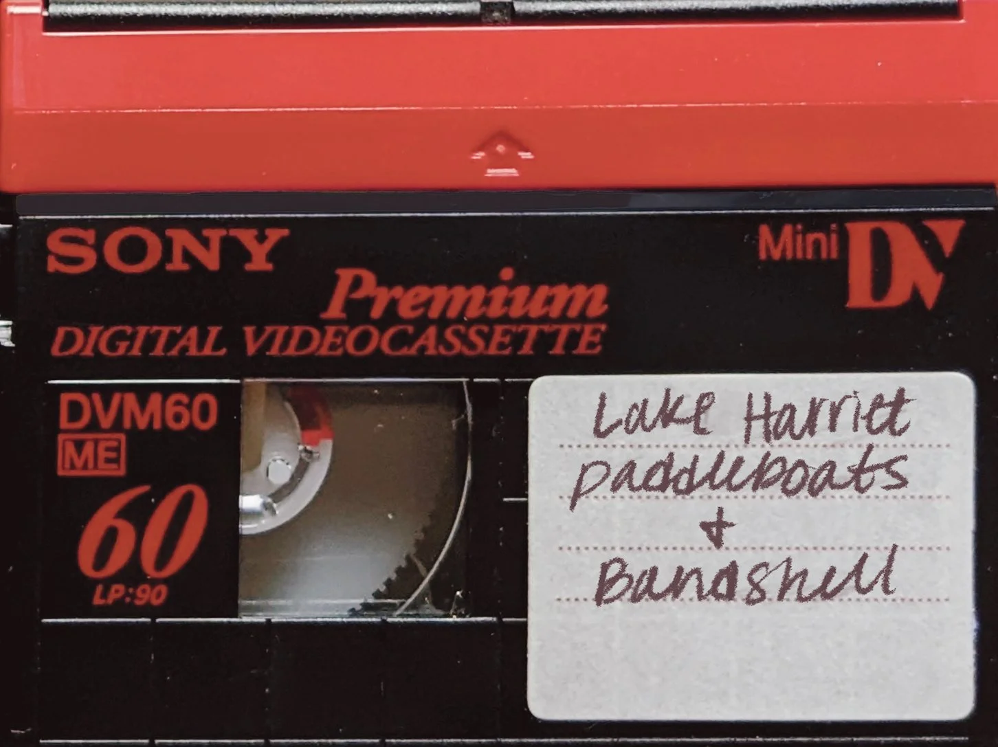 Mini DV tape labeled Lake Harriet Paddleboats and Bandshell