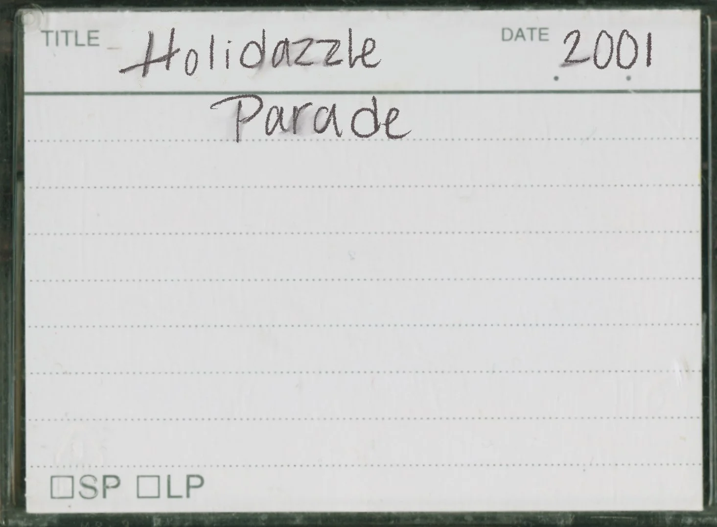 Mini DV tape case labeled Holidazzle Parade 2001