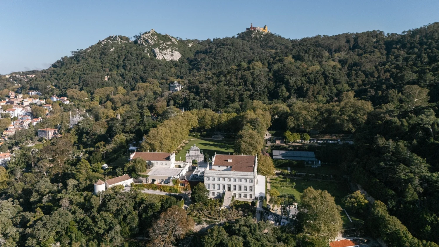 Aerial view of Valverde Sintra Palácio de Seteais with Pena Palace above the wooded hills