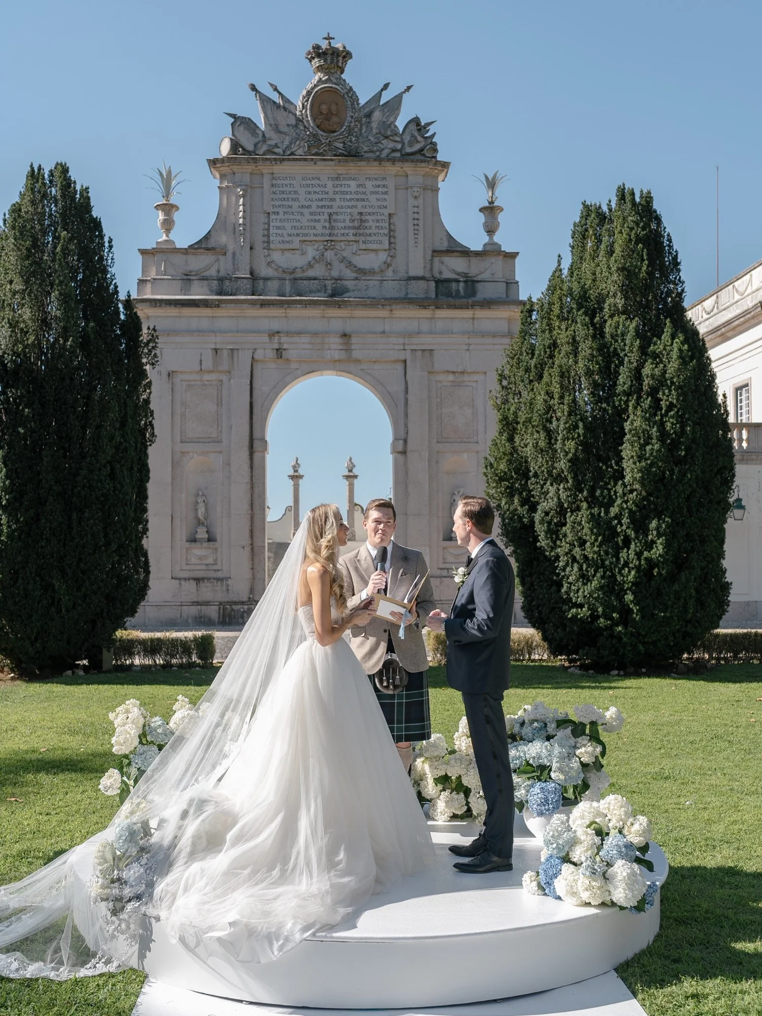 Jennifer and Trevor during their outdoor wedding ceremony at Seteais