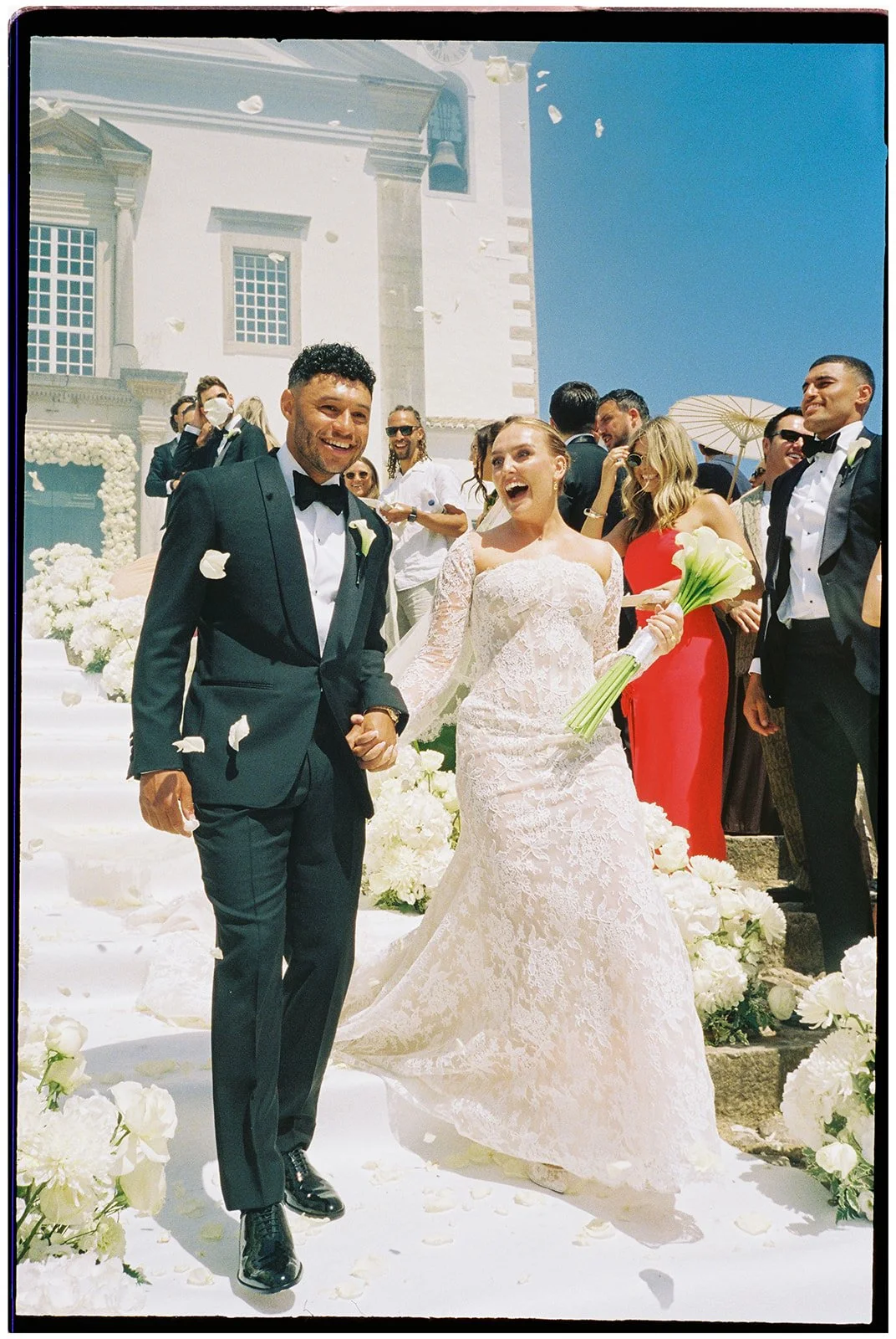 Perrie and Alex leaving the church together, photographed on film