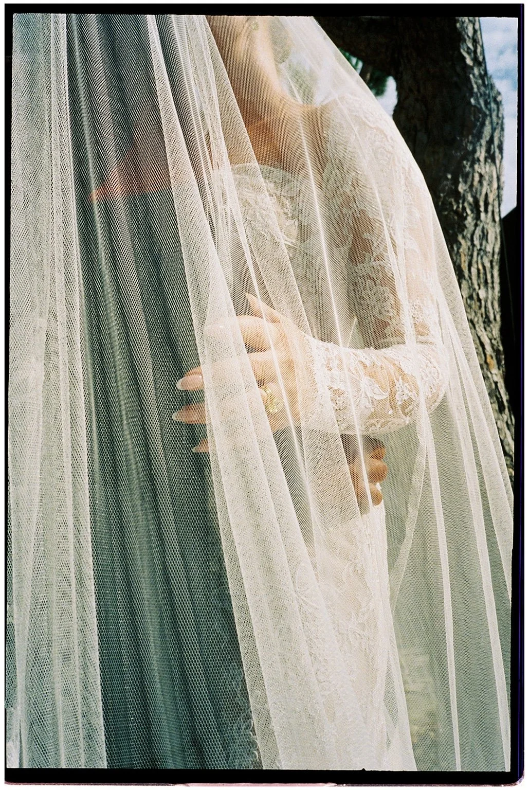 Film photograph of Perrie’s lace gown and veil