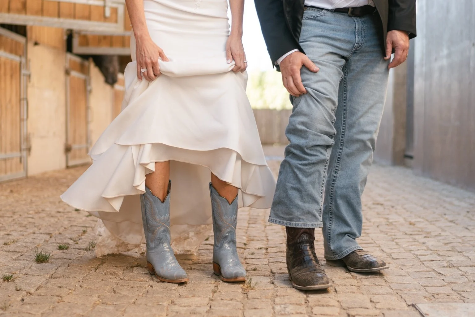 Joanna’s blue cowboy boots beneath her dress, beside Greg’s jeans and boots.