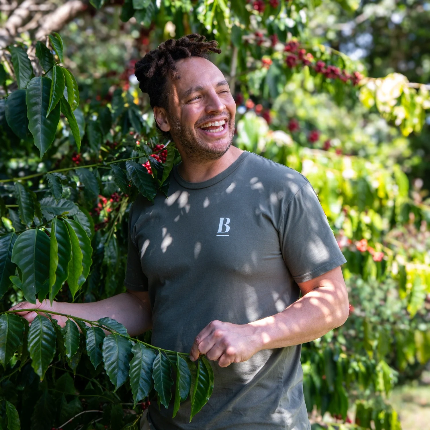 Danny Andrade among coffee trees at origin