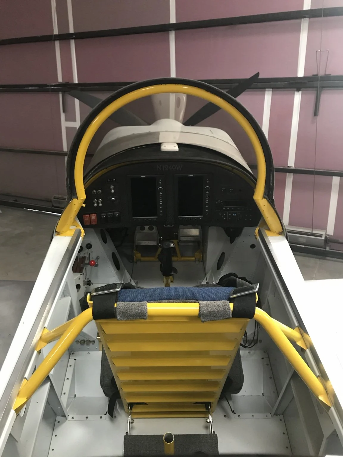 RV-8 cockpit with dual portrait displays and radios at the far right