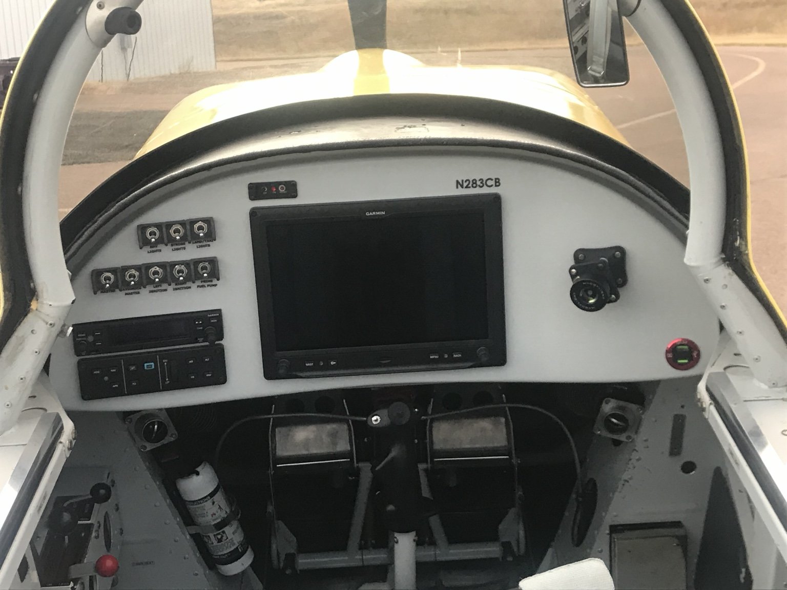 Front view of the custom-molded RV-8 panel showing the centered EFIS and radios at the far left