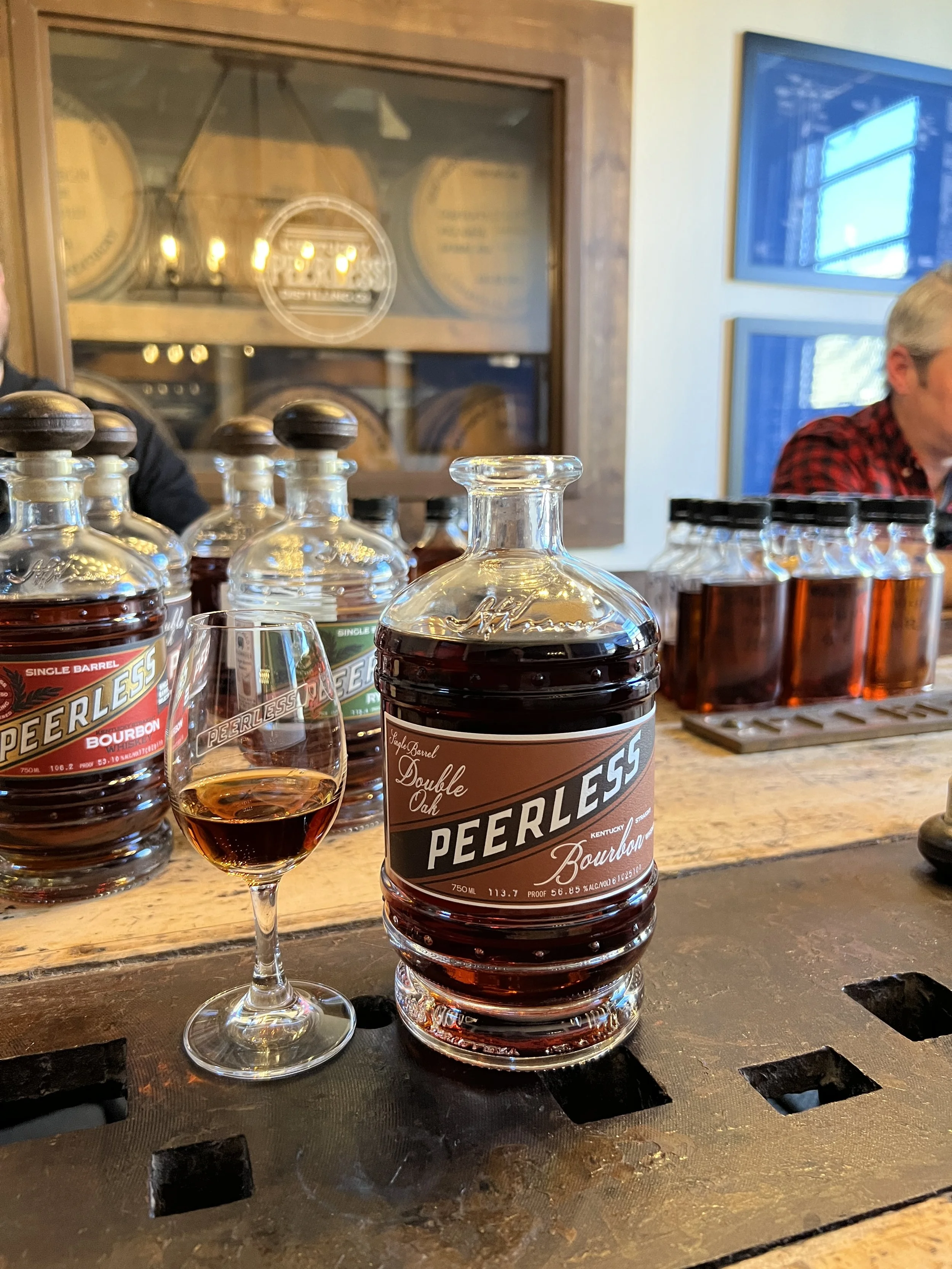 Peerless Double Oak Bourbon poured into a glass at the Kentucky Peerless tasting room