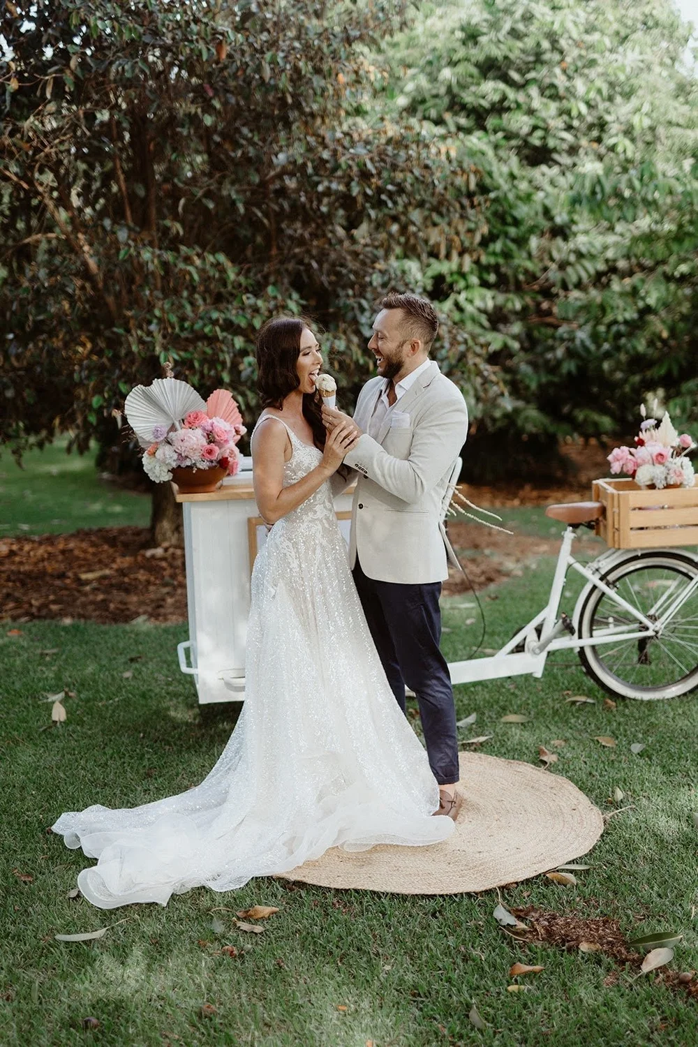 Bride and groom sharing a gelato cone