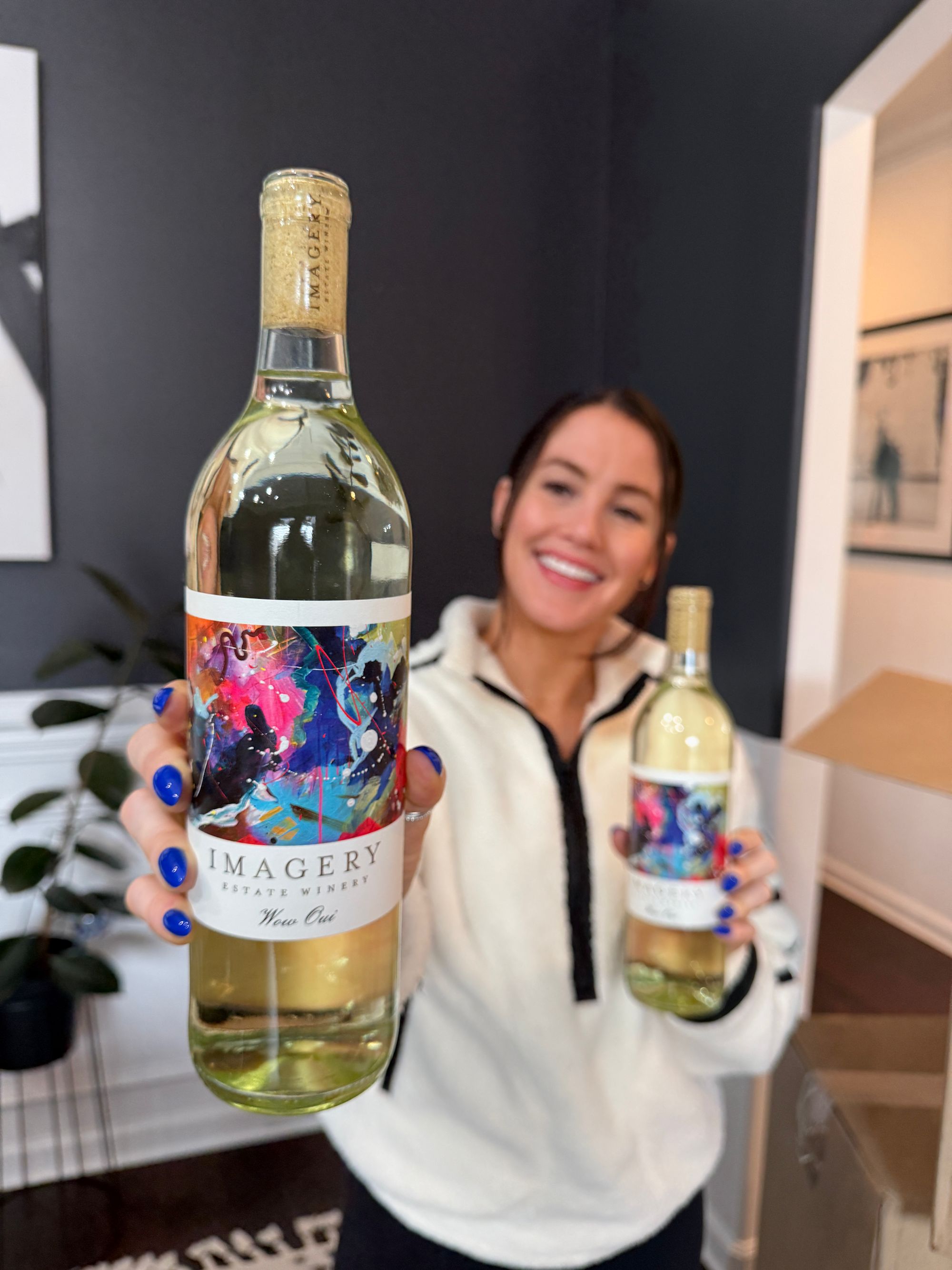 Holding the Wow Oui bottle