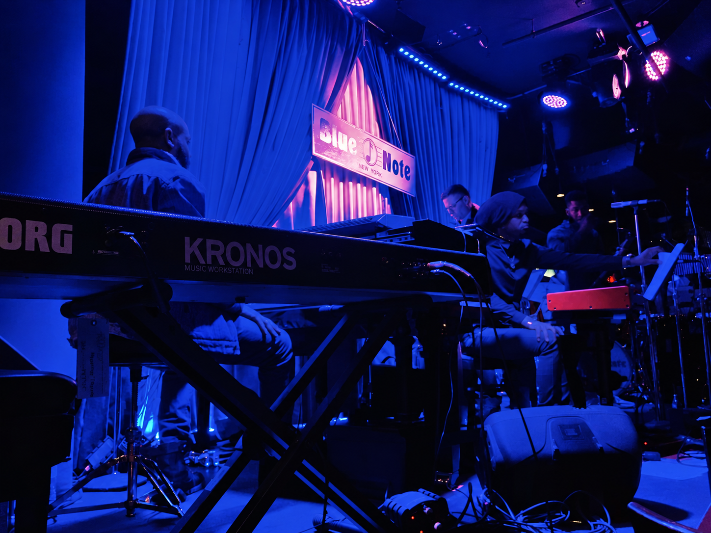Keyboard performance on a blue-lit stage