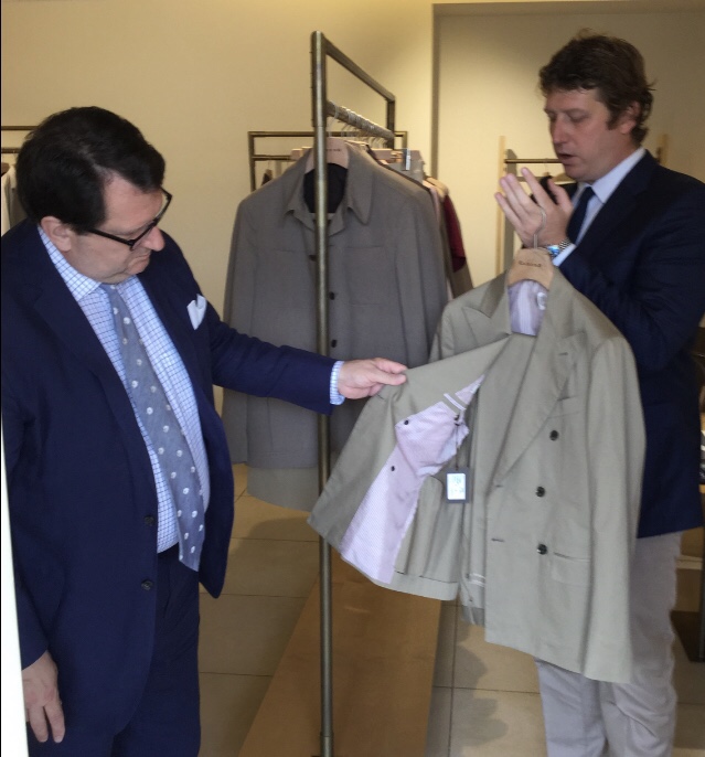Joel pointing at a suit