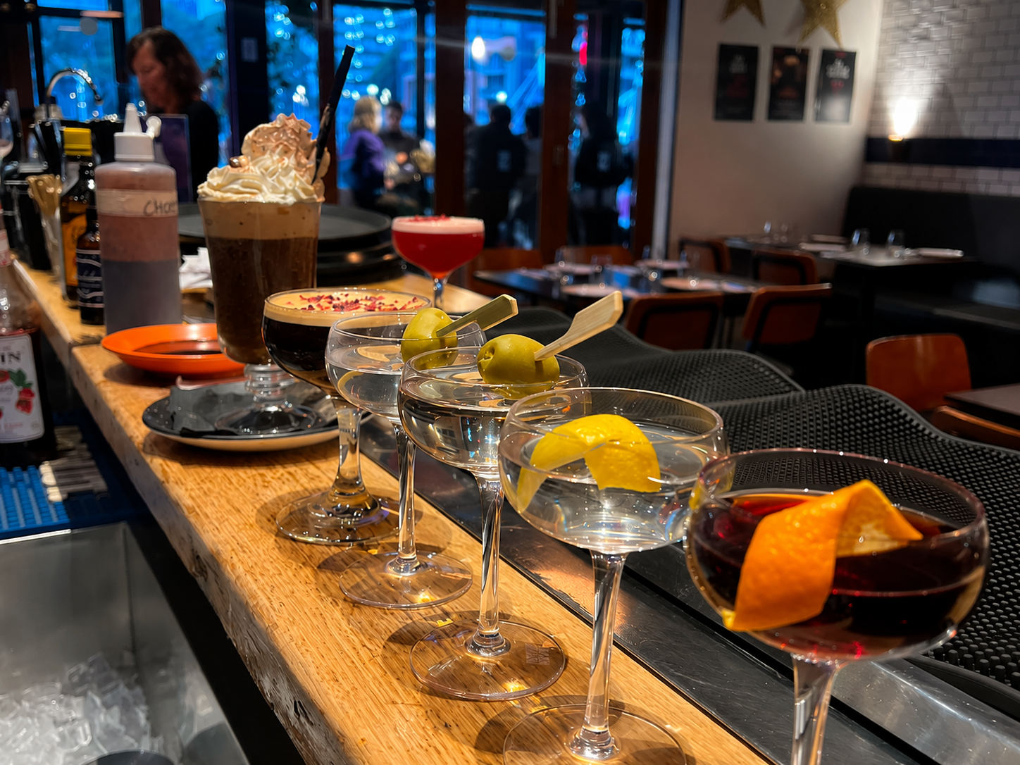 Cocktails lined up on the bar at Plus 5 Bar South Wharf