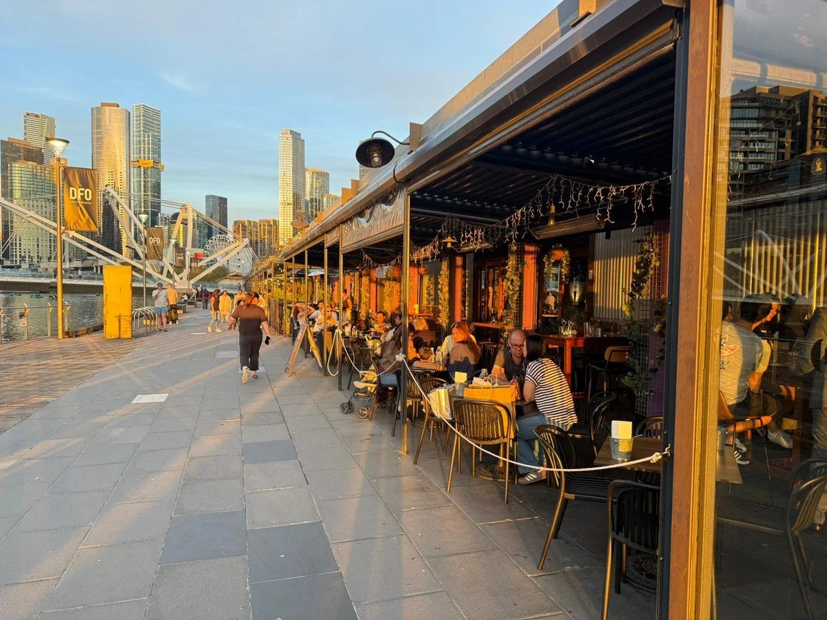 Outdoor dining at Plus 5 Bar on the South Wharf riverside promenade in Melbourne