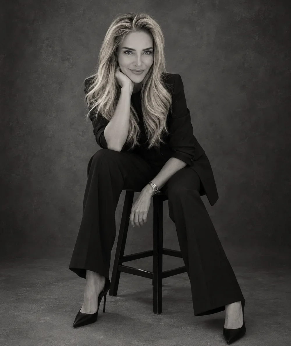 Dr. Colleen Long seated in a black suit