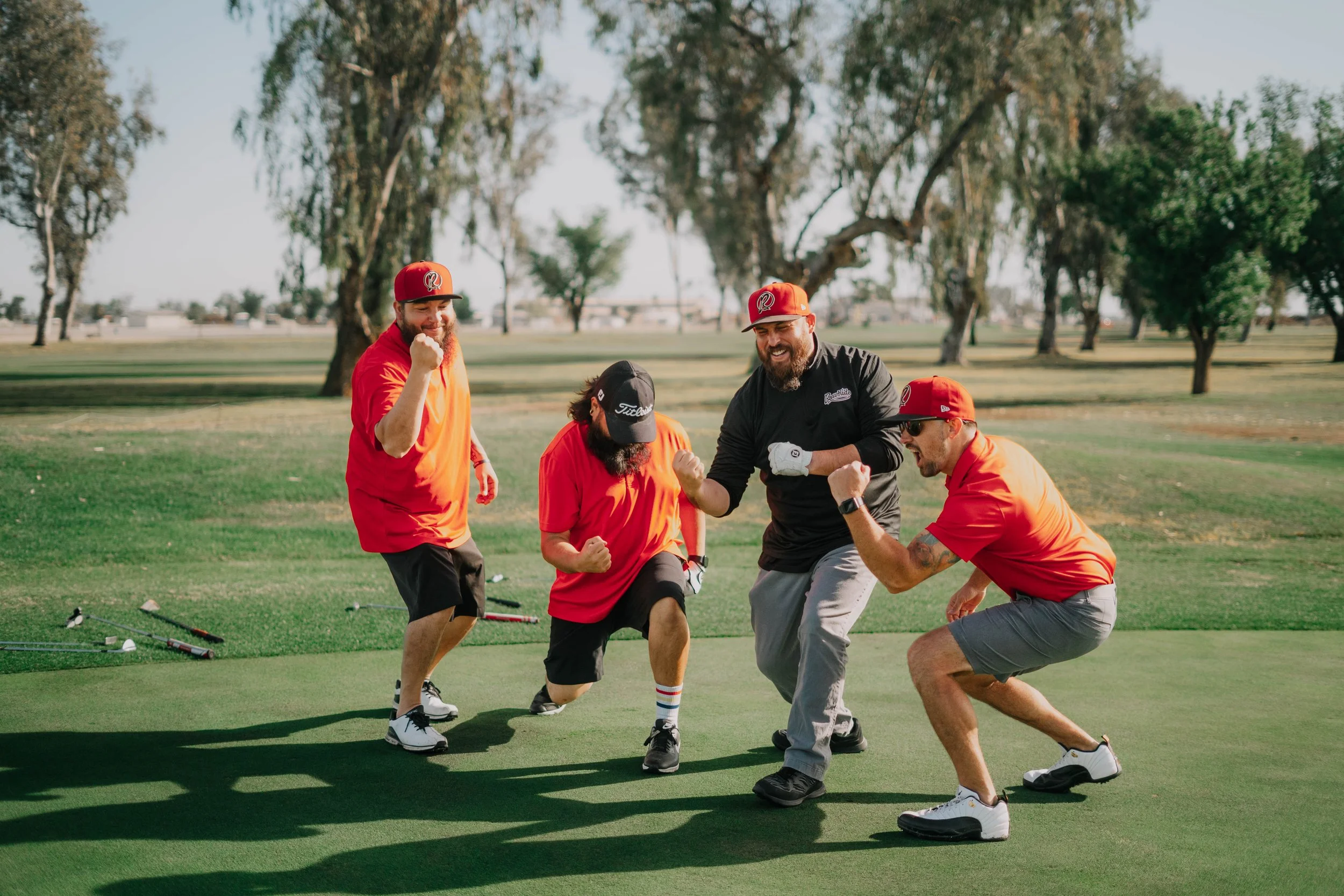 A foursome laughing together on the course