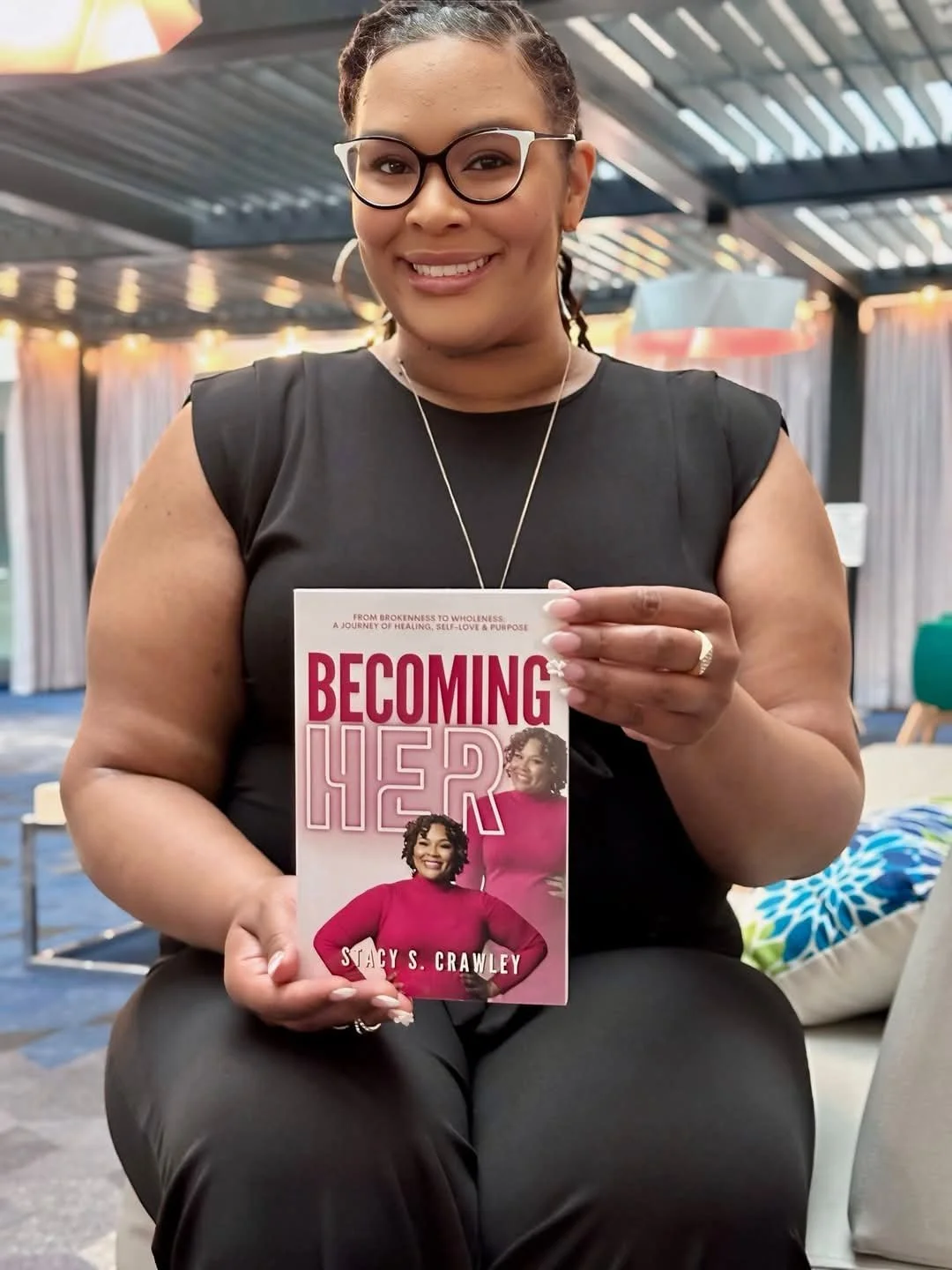 Stacy S. Crawley holding Becoming Her