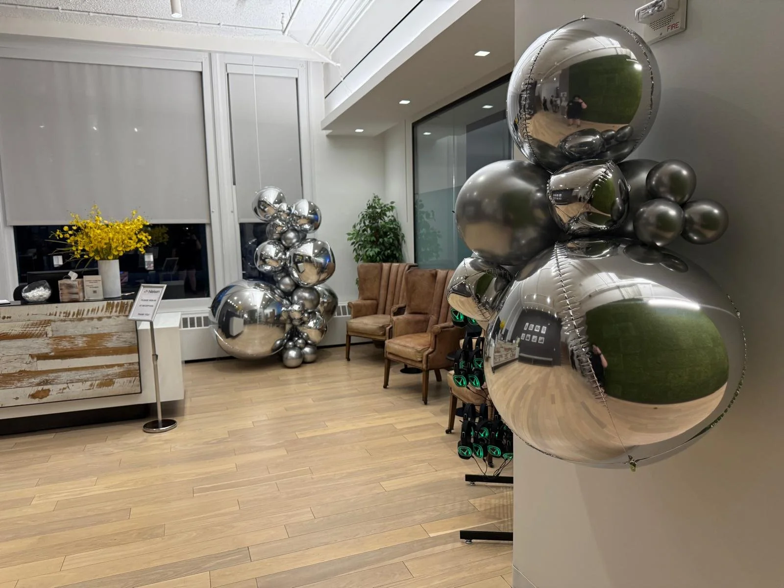 Silver balloon columns in the reception lobby at Nielsen in Chelsea NYC