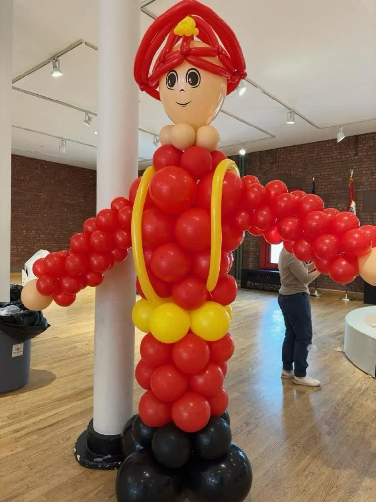 Custom firefighter balloon sculpture at NYC Fire Museum Hudson Square Manhattan