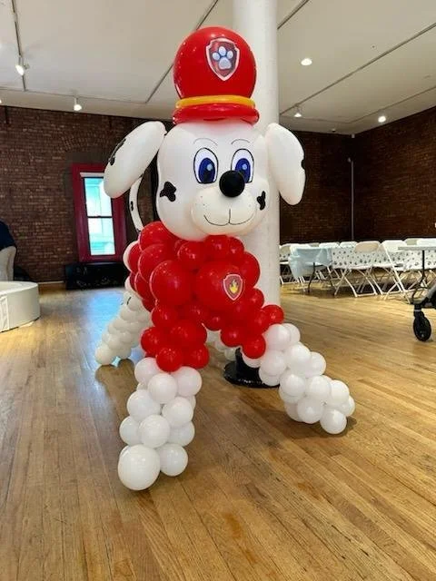 Marshall Paw Patrol balloon sculpture at NYC Fire Museum Hudson Square Manhattan kids event