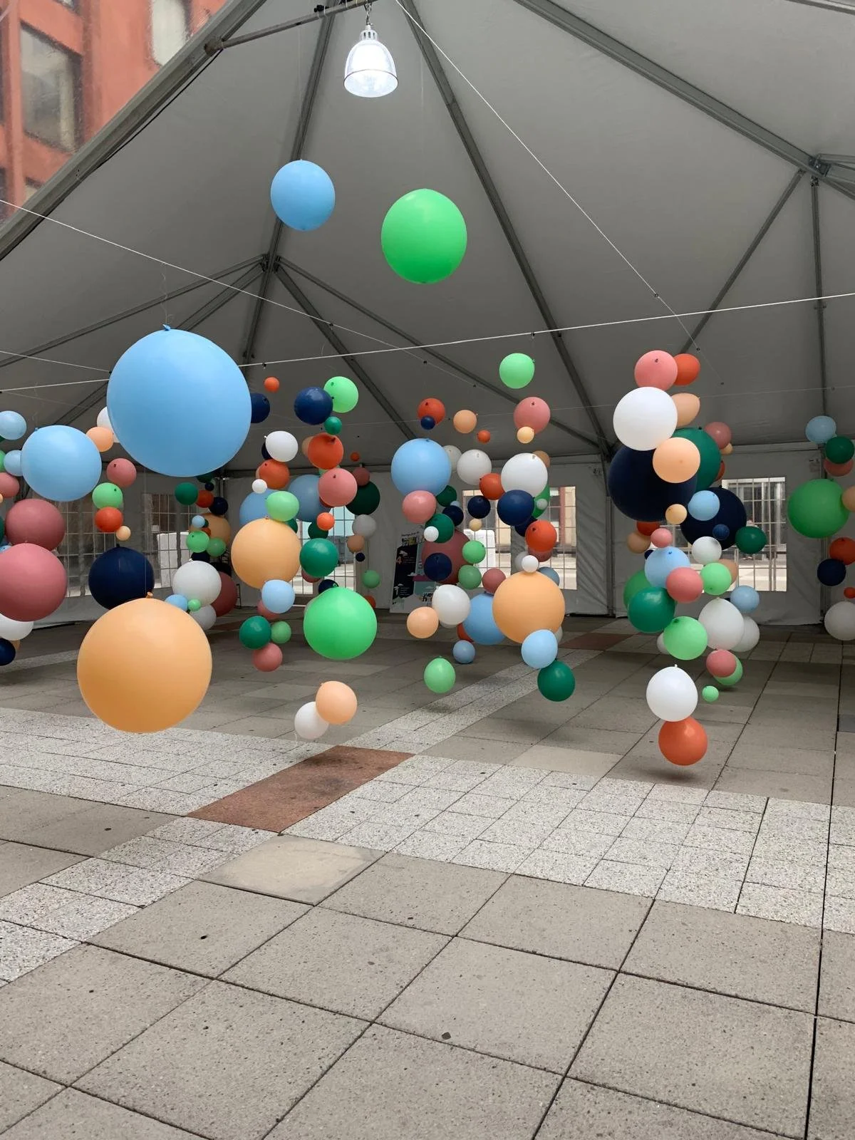Immersive walk-through balloon installation with suspended balloons at NYU Greenwich Village Manhattan NYC