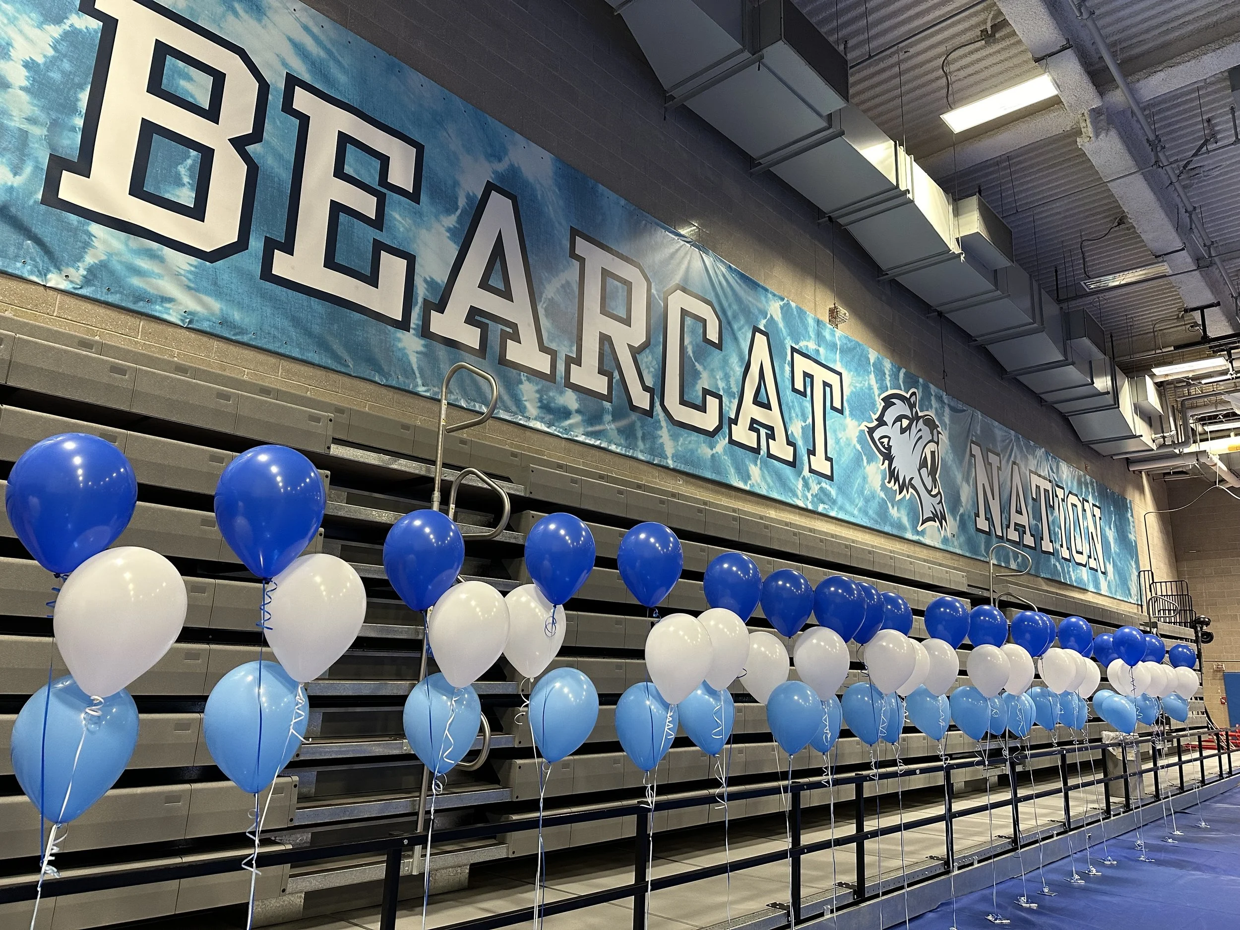 Blue and white balloon clusters Baruch College orientation NYC