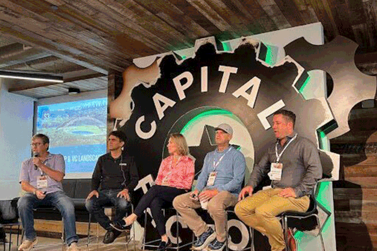 S3 Ventures sign with a group of people behind it in the background. 