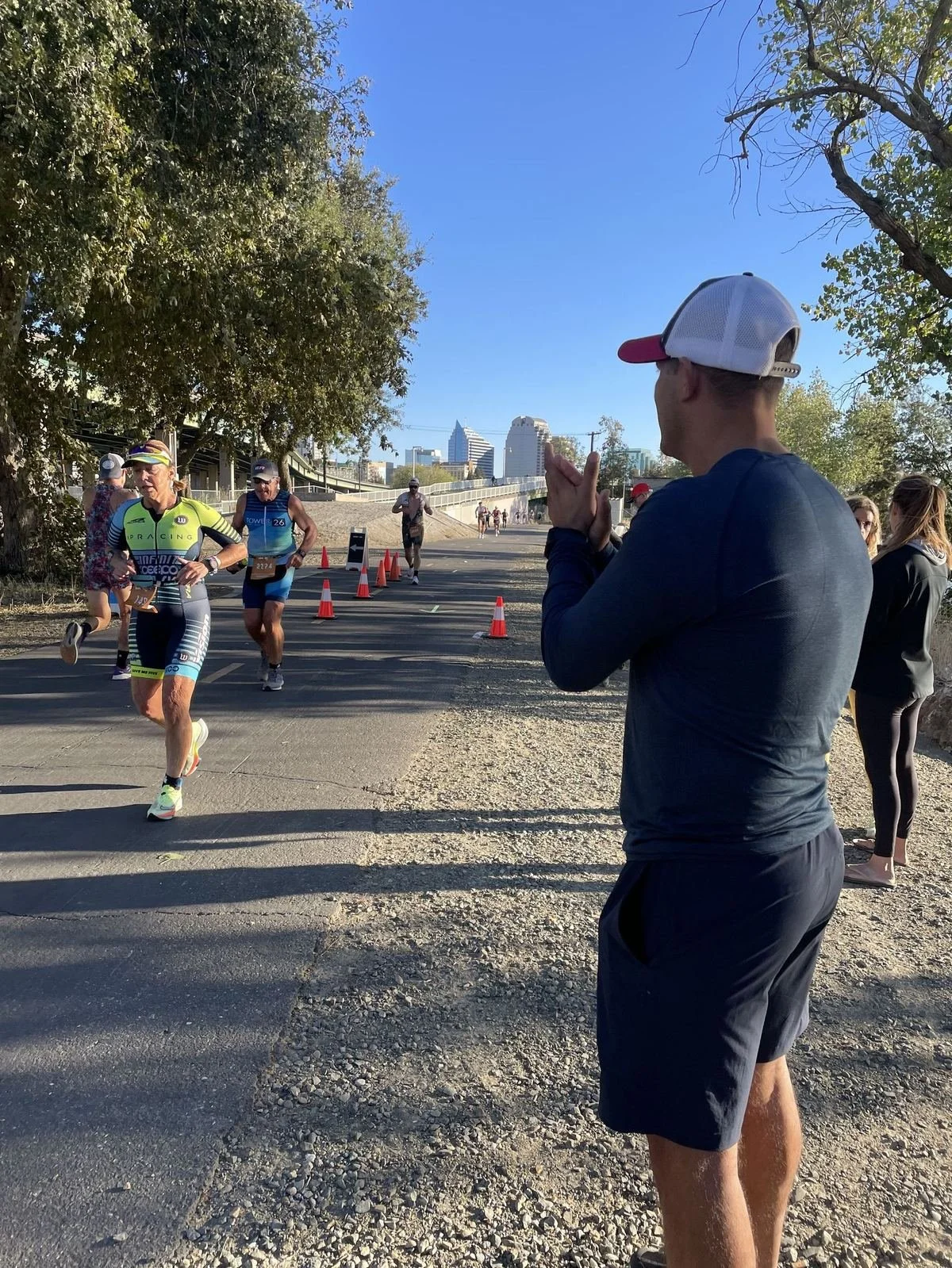 Francisco cheering on runners at a race