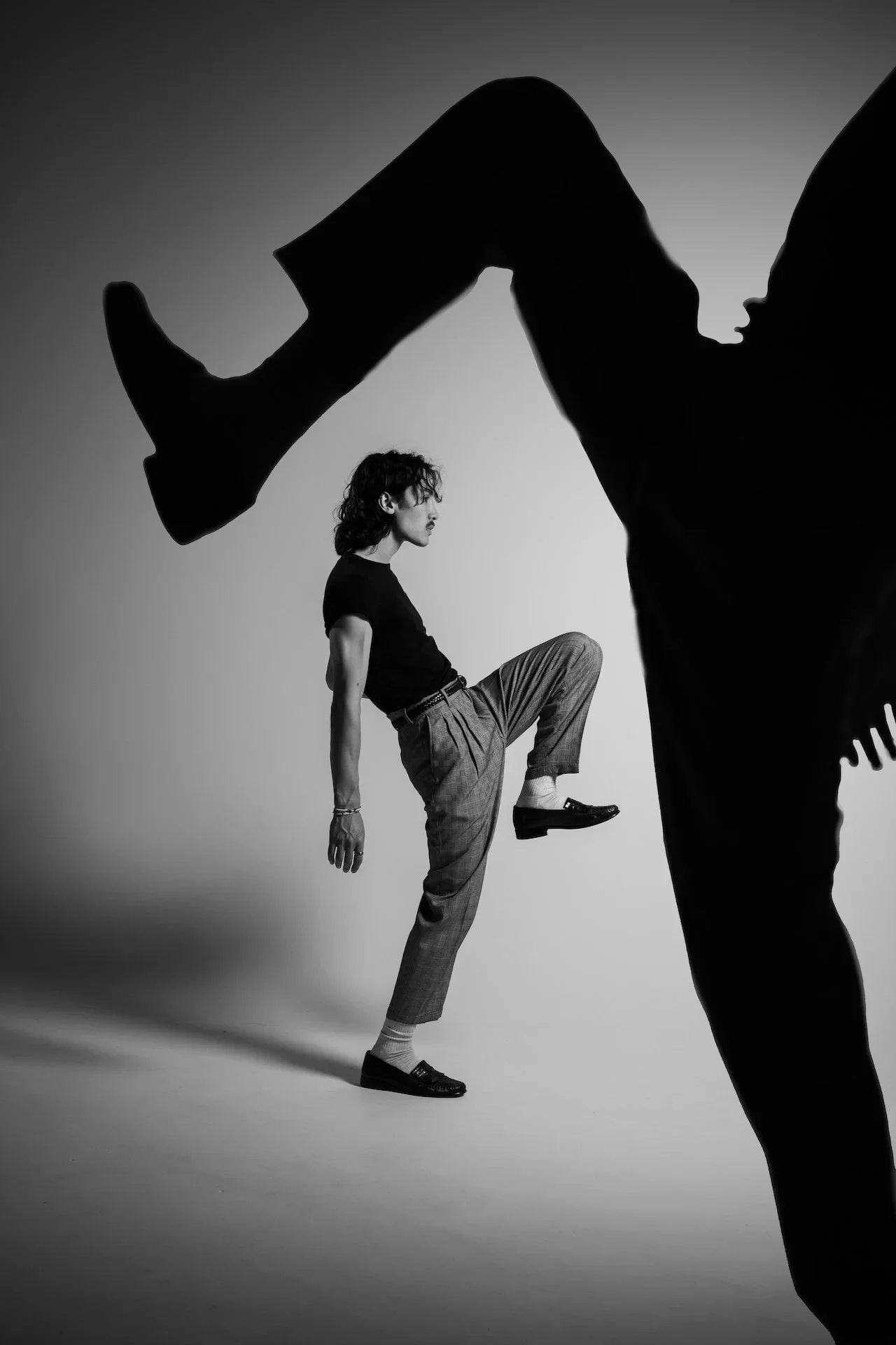 Nashville portrait photographer Hunter Hart - black and white studio dance portrait with dramatic shadow