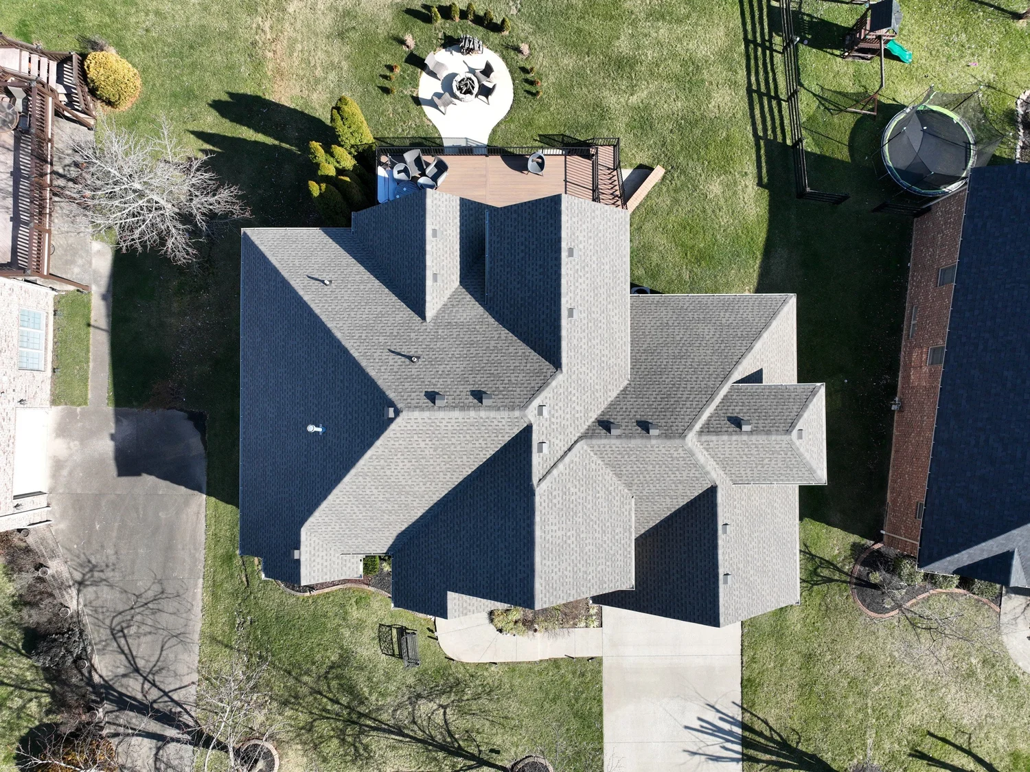 Overhead view of a completed Reformation roof showing shingle courses, hips, valleys and roof vents