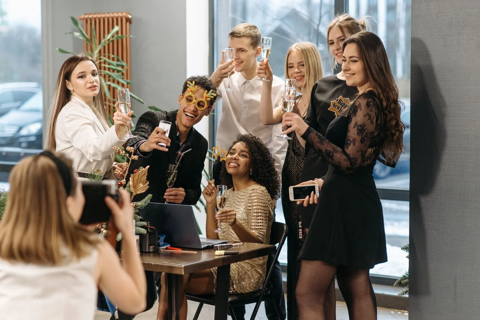Guests posing for a group photo at a Los Angeles party covered by an event photographer