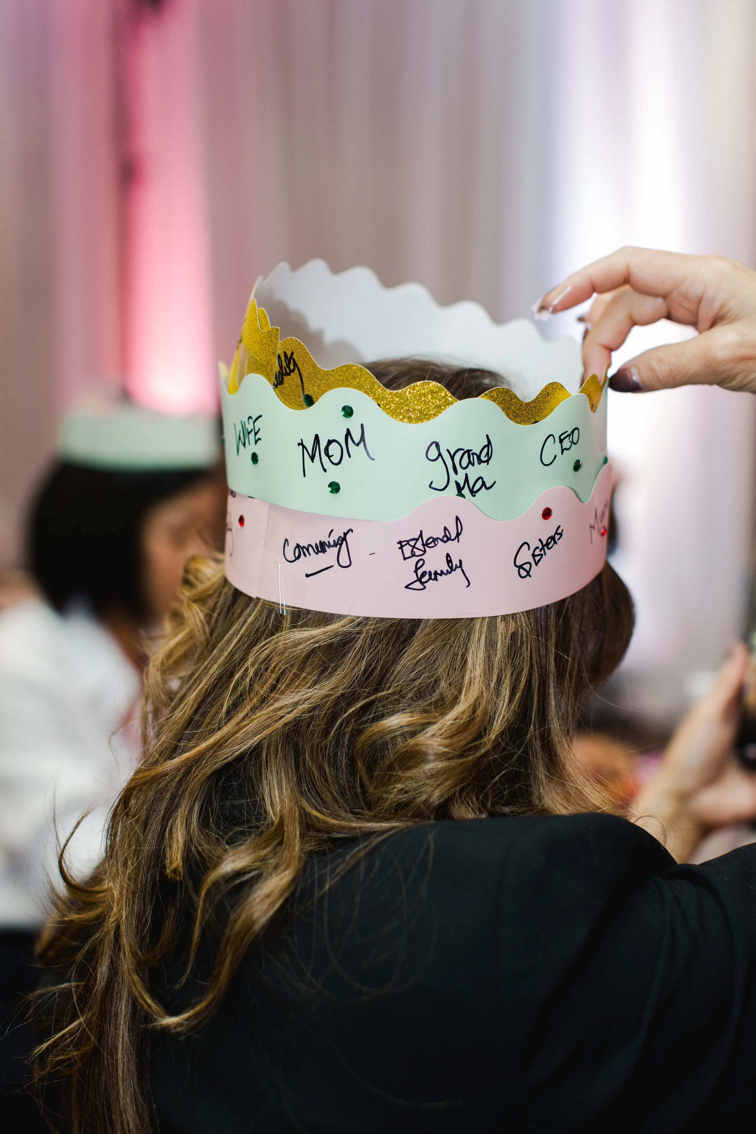 A crown assembled from three paper hats during The Many Hats We Wear workshop.