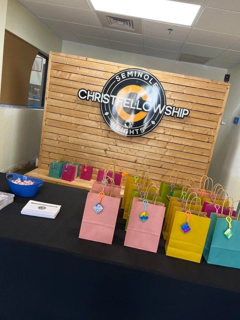 Guest Central at Christ Fellowship with gift bags prepared for first-time guests