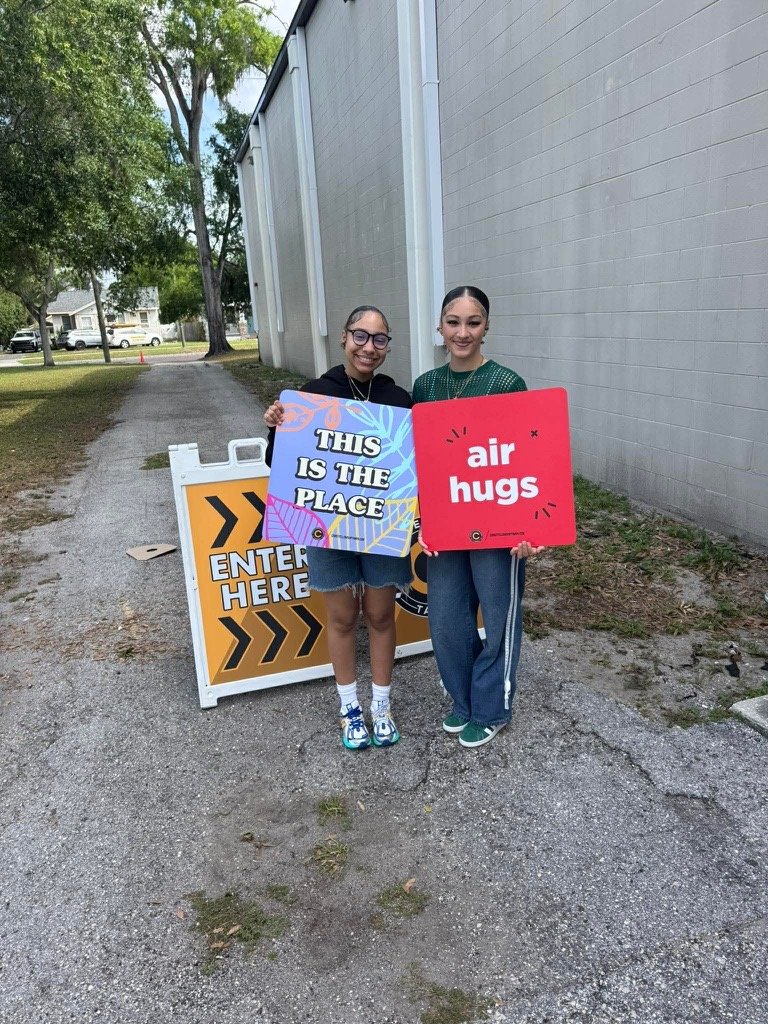Young adults welcoming people to Christ Fellowship on Sunday morning