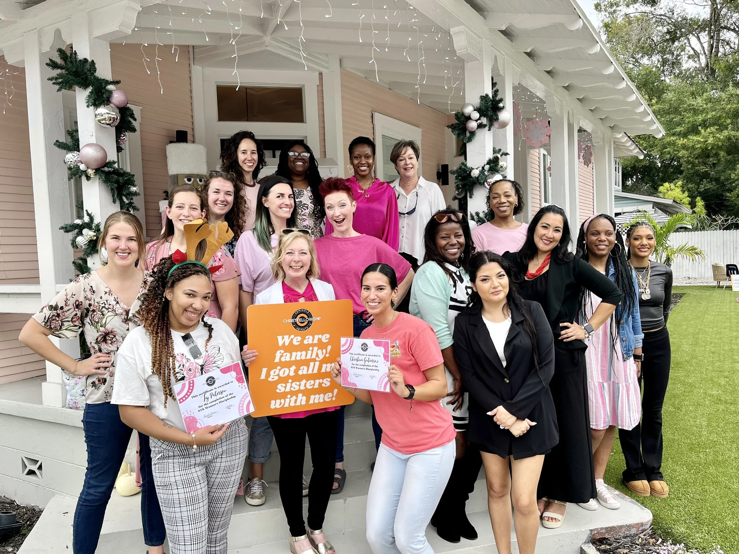 A joyful, multi-generational group of women gathered at a Christ Fellowship discipleship event